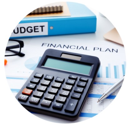 circular image of a black calculator placed on top of a printed financial plan upon a desk