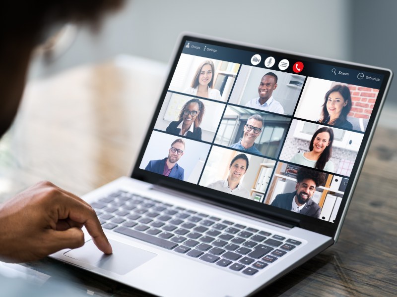 laptop screen showing finance training being delivered on a video call with 9 participants