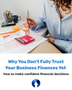 Blog cover image: a Lady taps numbers into her pink calculator with her pen. the title of the blog is: Why you don't fully trust your business finances yet